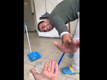 A screenshot from a smartphone video of Yousef Abu Jaber laughing and high fiving an Israeli middle school student.