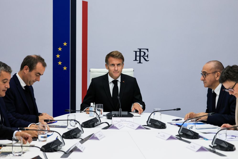 France's President Emmanuel Macron, center, hosts an Interministerial Crisis Meeting at the Elysee Presidential Palace, in Paris, on Sunday, Oct. 18, 2026 the day after nationwide riots. 
