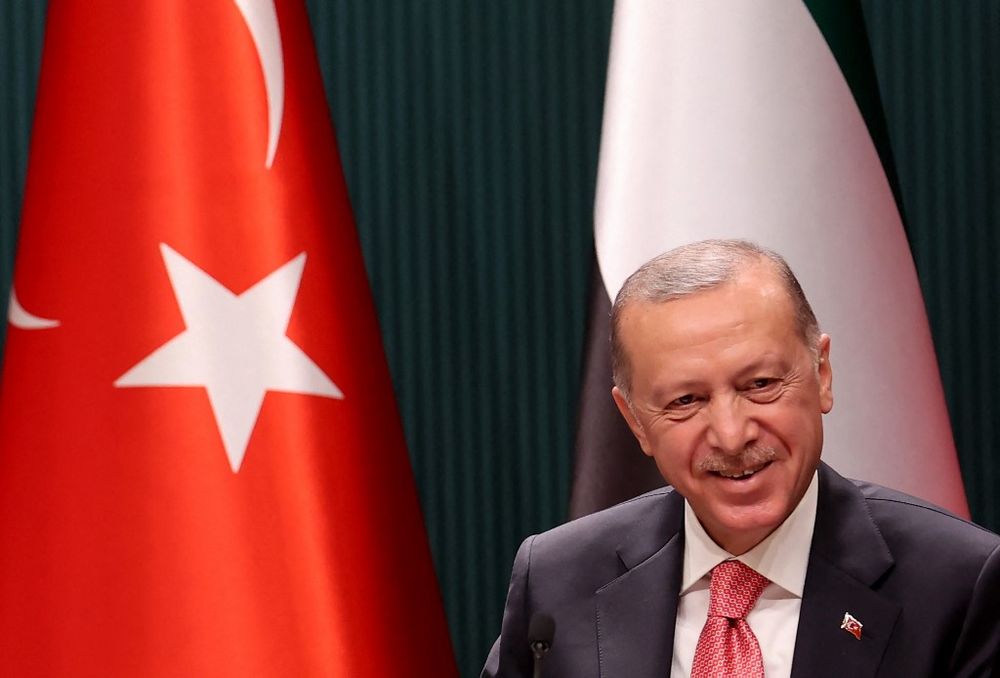 Turkish President Recep Tayyip Erdogan reacts as he attends a signing ceremony at the Presidential Complex in Ankara, Turkey, on November 24, 2021.