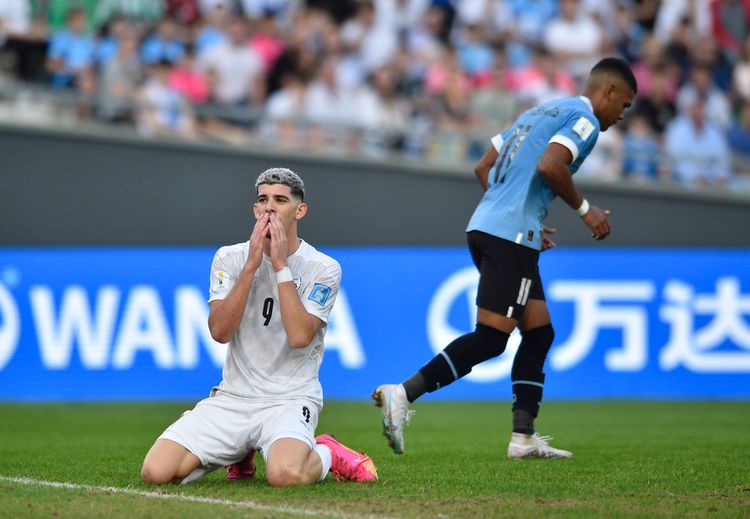Israel's Dor Turgeman (L) reacts after missing a chance to score against Uruguay during a FIFA U-20 World Cup semifinal soccer match in La Plata, Argentina.
