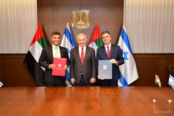 L-R: UAE's envoy to Israel Mohamed Mahmoud Al Khaja, Israeli PM Benjamin Netanyahu, FM Eli Cohen.