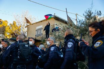 Activists protest against the expulsion of Palestinian families from their homes in the east Jerusalem neighborhood Sheikh Jarrah, on January 21, 2022.