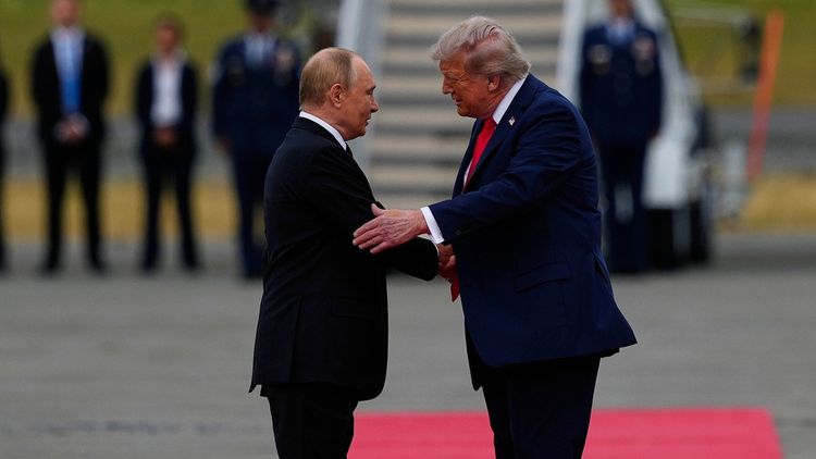Putin and Trump shaking hands in Alaska 

