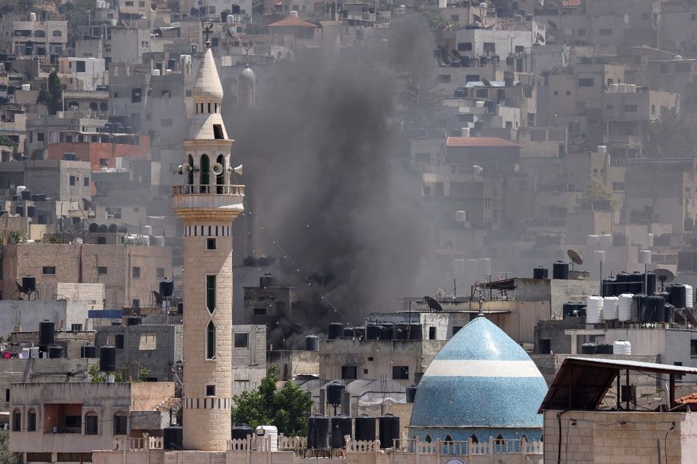 Smoke billows during an Israeli military operation in Jenin city in the West Bank.