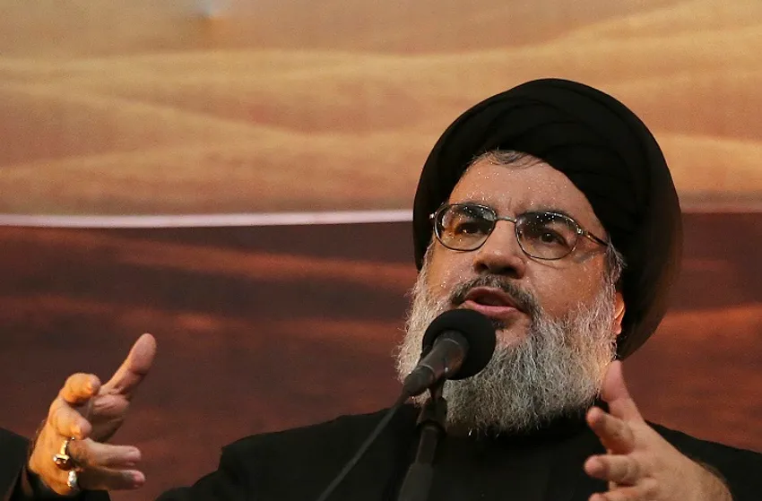 FILE -In this Nov. 3, 2014 file photo, Hezbollah leader Sheik Hassan Nasrallah addresses supporters ahead of the Shiite Ashura commemorations.