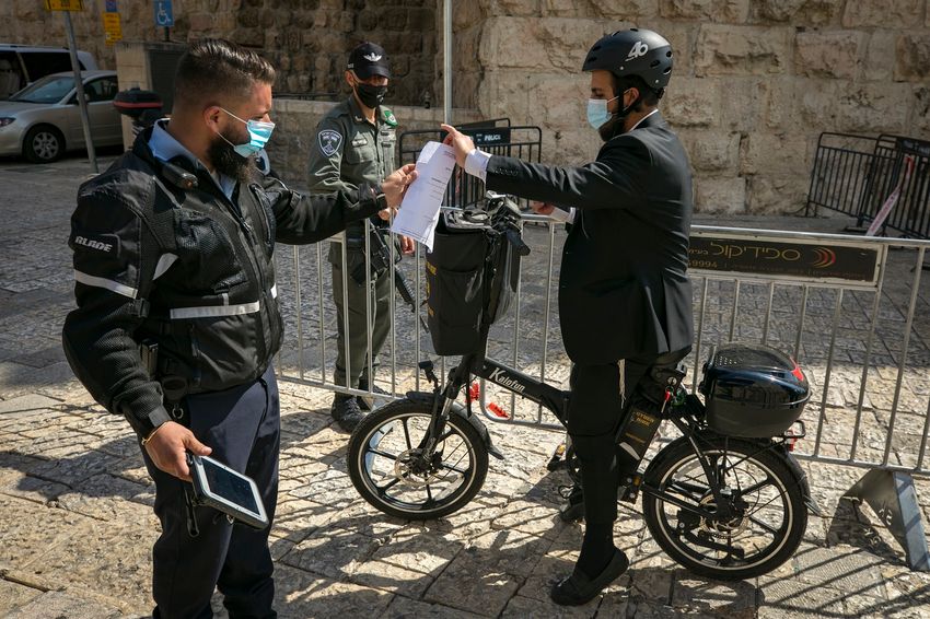 FILE - Israel Police stationed at a temporary checkpoint at the Jaffa Gate in Jerusalem, on October 01, 2020, during a nationwide lockdown to prevent the spread of COVID-19.