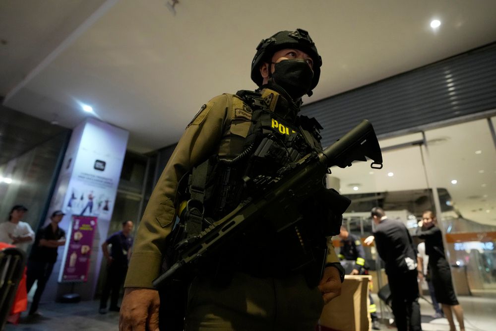Thai police officer leave from a shopping mall in Bangkok, Thailand