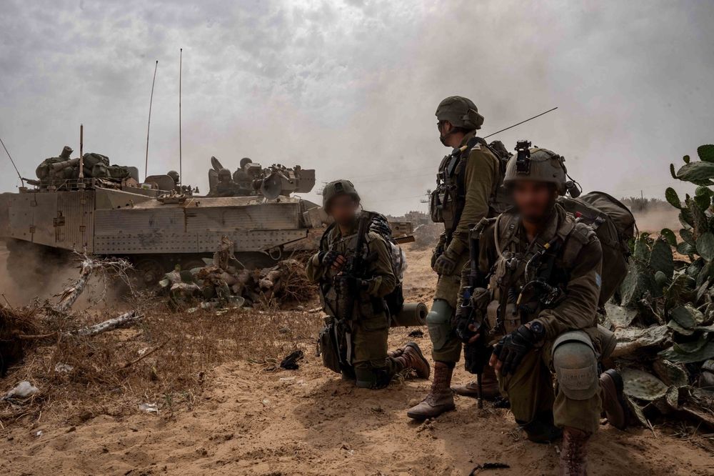 IDF troops with an armored personnel carrier in the Gaza Strip
