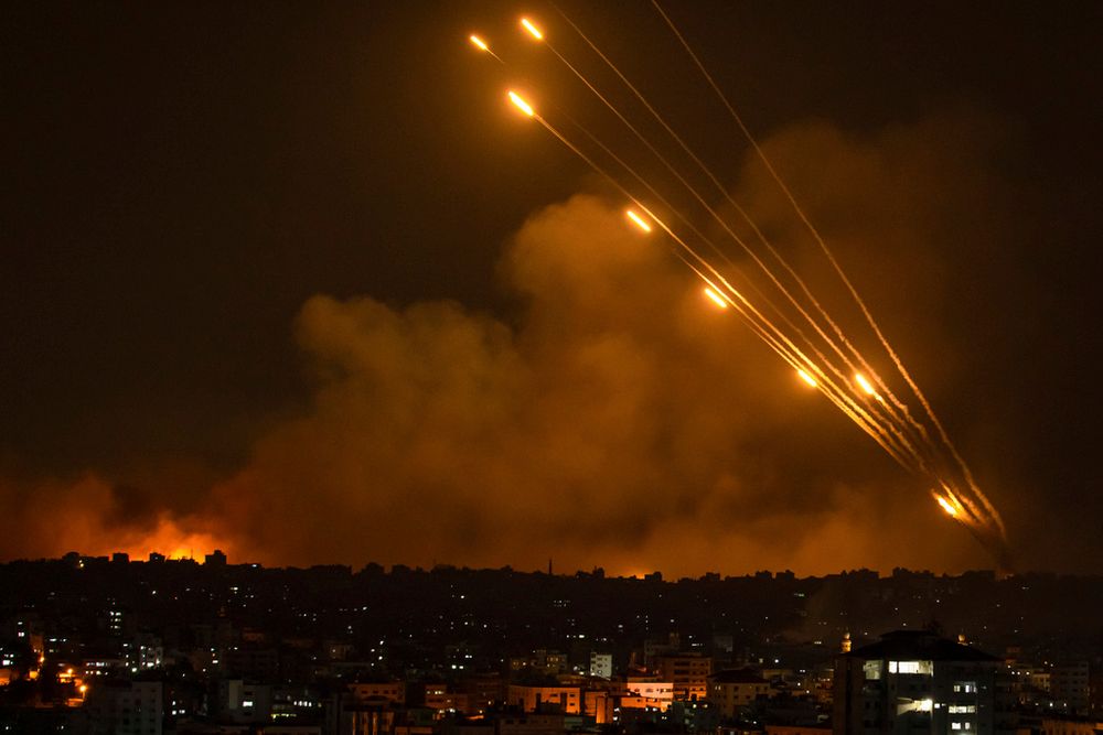 Rockets are fired toward Israel from the Gaza Strip, October 8, 2023.