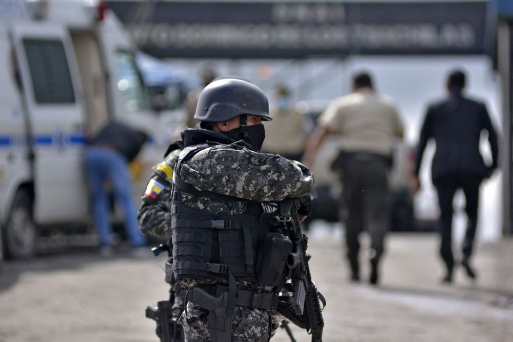 A policeman stands guard outside the Bellavista prison after a riot, in Santo Domingo de los Tsachilas, Ecuador, on May 9, 2022.