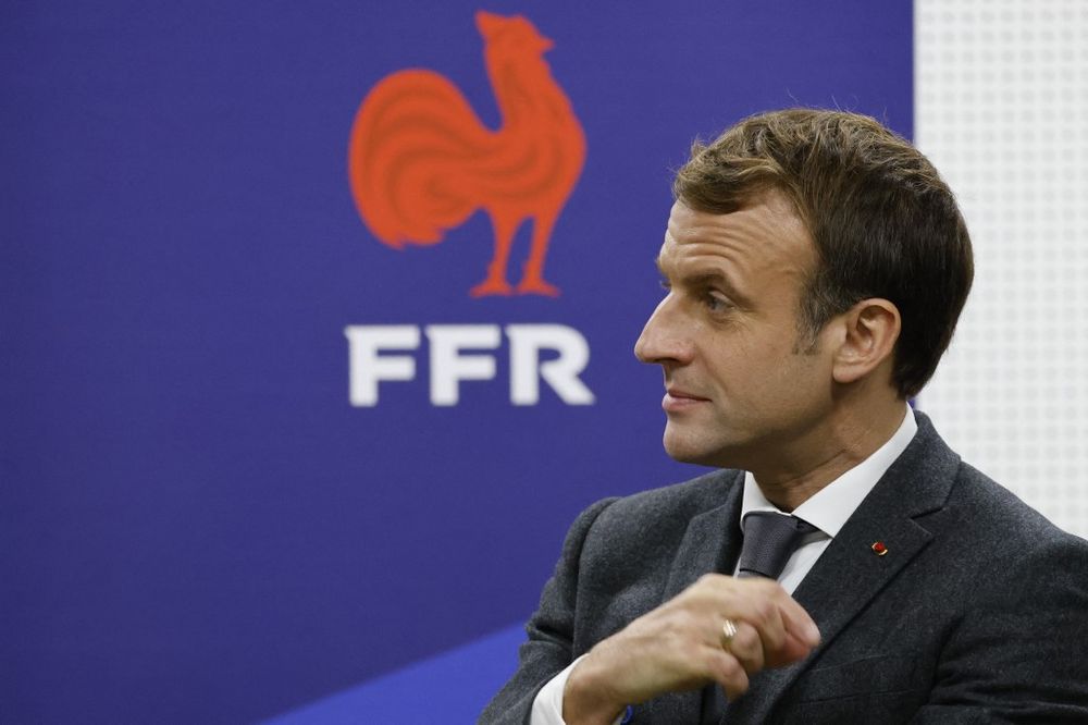 France's President Emmanuel Macron gestures during a visit to meet France's men and women national rugby union teams at their training center in Marcoussis, south Paris on November 15, 2021.