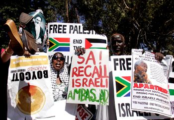A crowd of people protest outside the US consulate in Johannesburg, South Africa, Friday Jan. 2, 2009, against Israel's air strikes on Gaza.