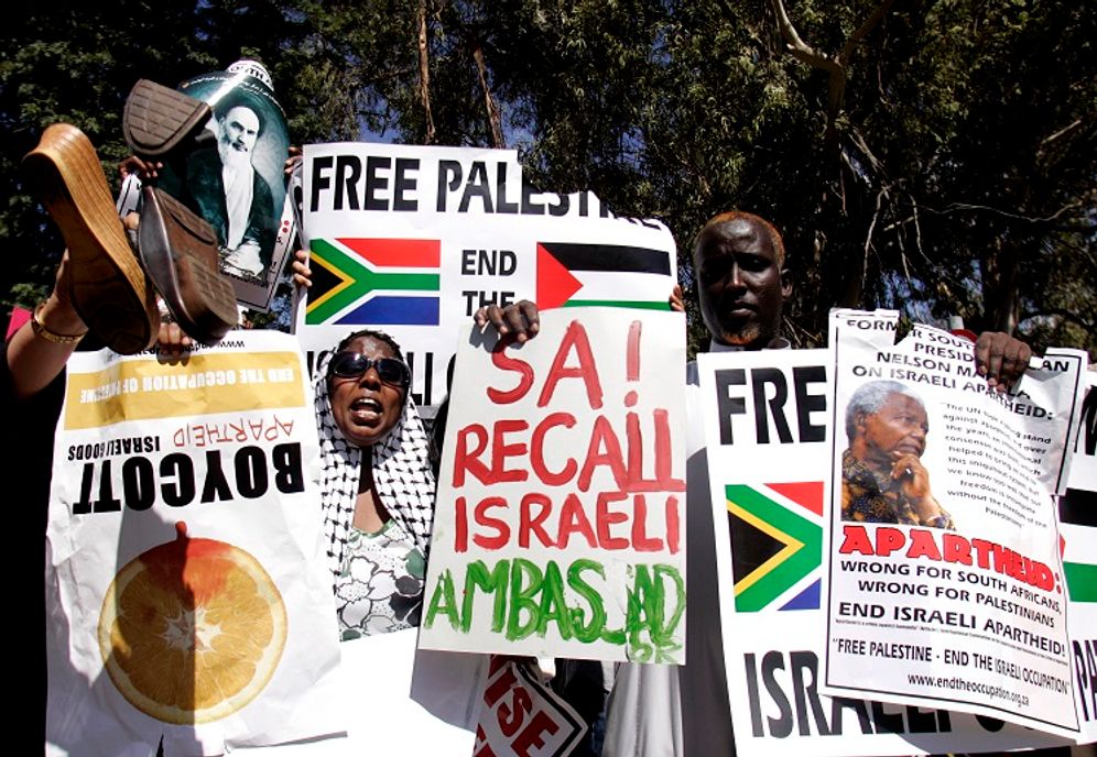 A crowd of people protest outside the US consulate in Johannesburg, South Africa, Friday Jan. 2, 2009, against Israel's air strikes on Gaza.