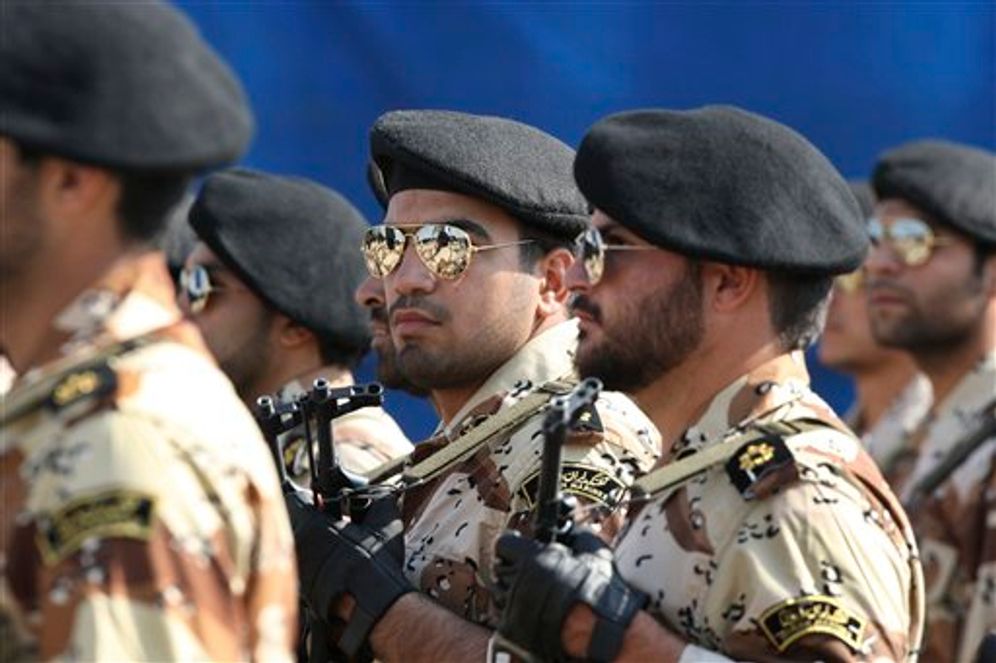 Members of Iran's Islamic Revolutionary Guard Corps march just outside Tehran, Iran, on September 22, 2011.