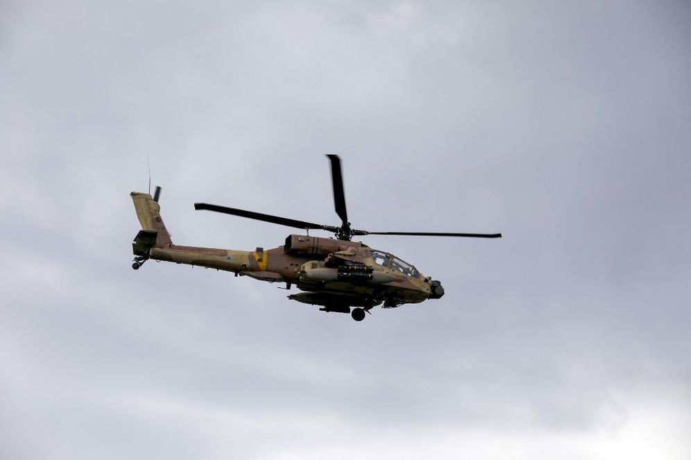 An Israeli army helicopter flies over the Golan Heights on January 3, 2020.