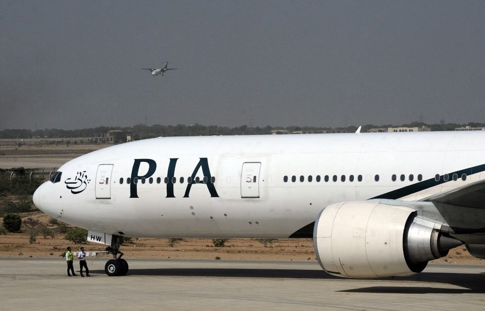 A Pakistan International Airlines plane taxies before take-off from Karachi International Airport in Karachi, Pakistan, on April 21, 2010.