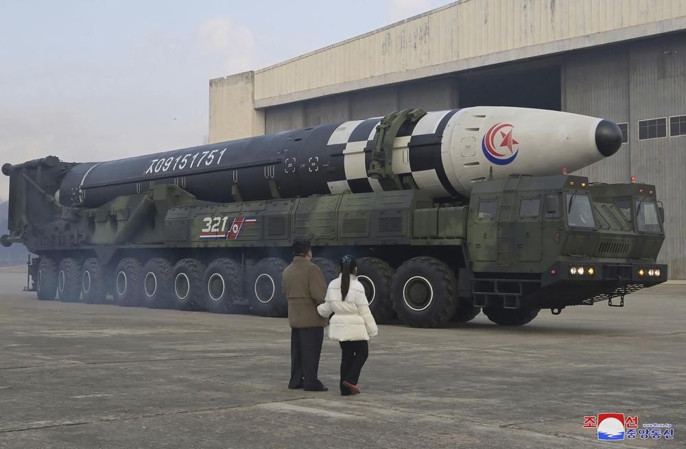 North Korean leader Kim Jong Un (L) and his daughter inspect a Hwasong-17 intercontinental ballistic missile at Pyongyang International Airport in Pyongyang, North Korea.