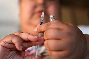 A woman with Type 2 diabetes prepares to inject herself with insulin at her home in Las Vegas, Nevada, United States.