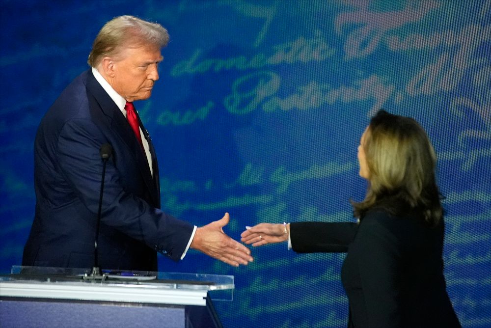 Republican presidential nominee former President Donald Trump shakes hands with Democratic presidential nominee Vice President Kamala Harris during an ABC News presidential debate at the National Constitution Center in Philadelphia

