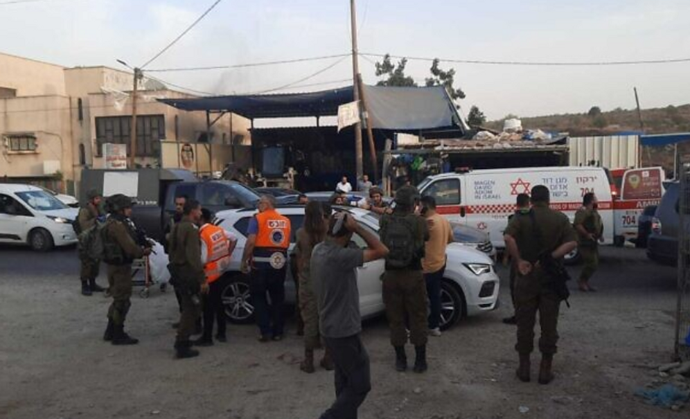 Flash90 Israeli soldiers and medics at the scene of a stabbing attack in the West Bank village of Al Funduq, on October 25, 2022.