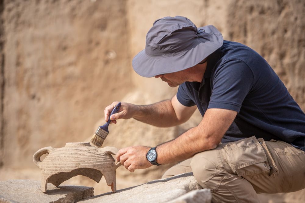 Archaeologists and workers excavate a dig site where the first ever building dating from the time of the Sanhedrin, recently discovered during excavations in the central town of Yavne, November 29, 2021.