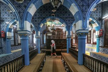 A tourist visits La Ghriba, the oldest synagogue in Africa, on the Island of Djerba, southern Tunisia.