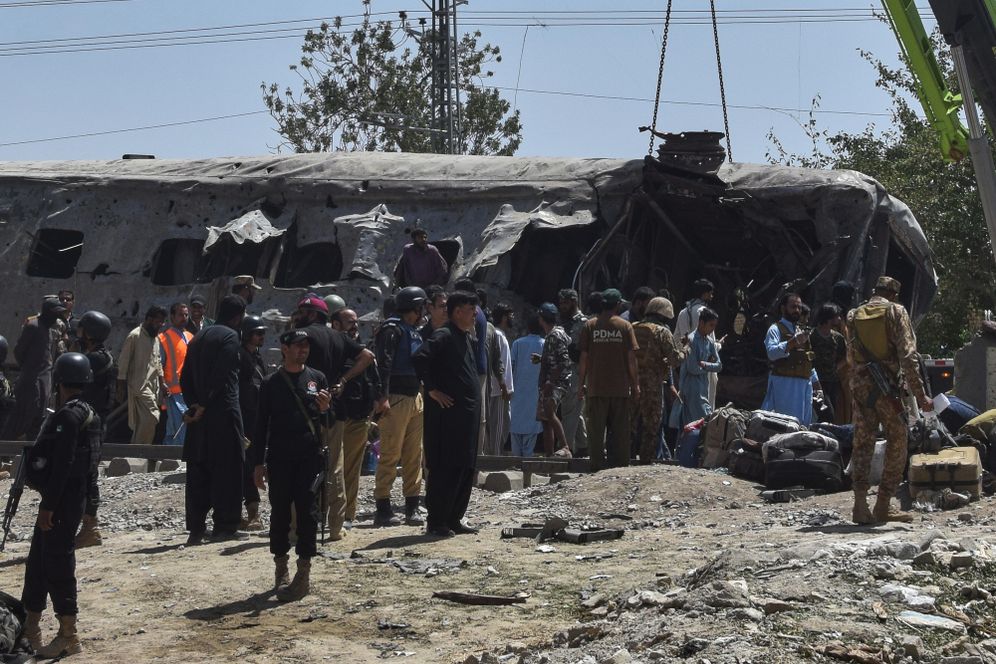 (AP Photo/Arshad Butt) Security officials examine a damaged train coach on a railway track at the site of bomb explosion, in Quetta, Pakistan, Sunday, May 24, 2026
