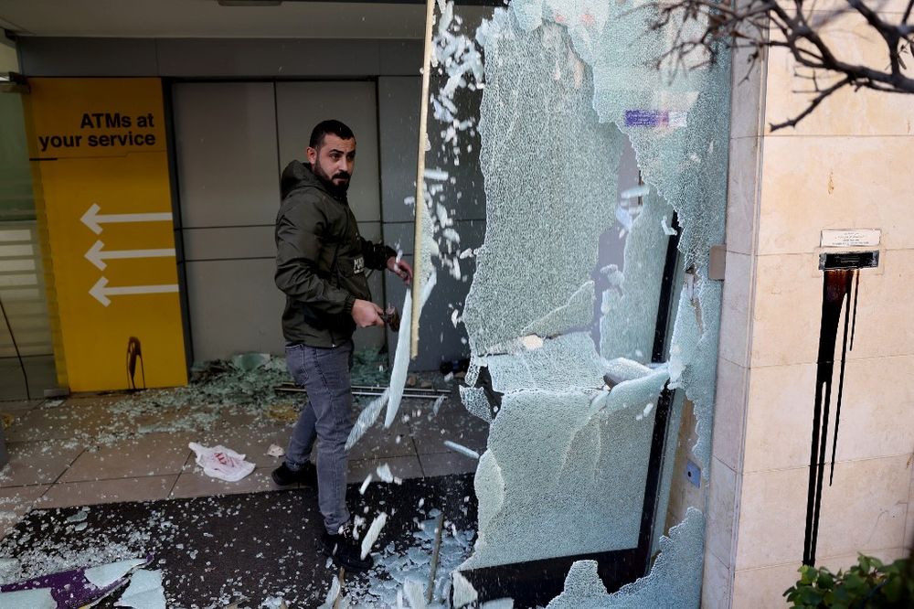 Angry Lebanese protesters vandalize banks in Beirut, Lebanon.