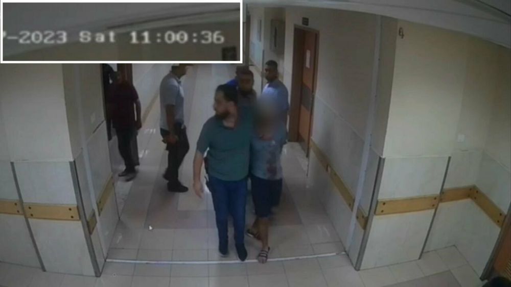 CCTV camera footage from the Shifa hospital showing medics casually consorting with Hamas gunmen manhandling hostages.