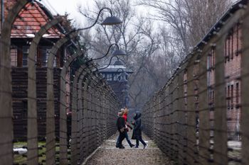 People visit the former Nazi German concentration and extermination camp Auschwitz-Birkenau in Oswiecim, Poland, on January 26, 2023.