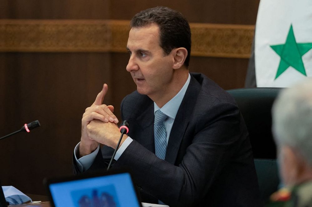 Syrian President Bashar Al-Assad meeting with cabinet members in Damascus on March 30, 2021
