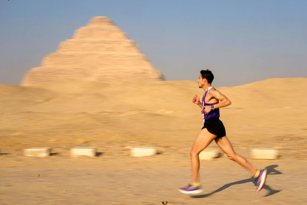 A runner competes in the Saqqara Pyramid Race in Saqqara, Egypt.