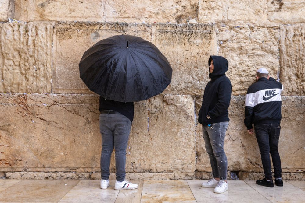 People pray at the Western Wall in the Old City of Jerusalem, December 01, 2021.