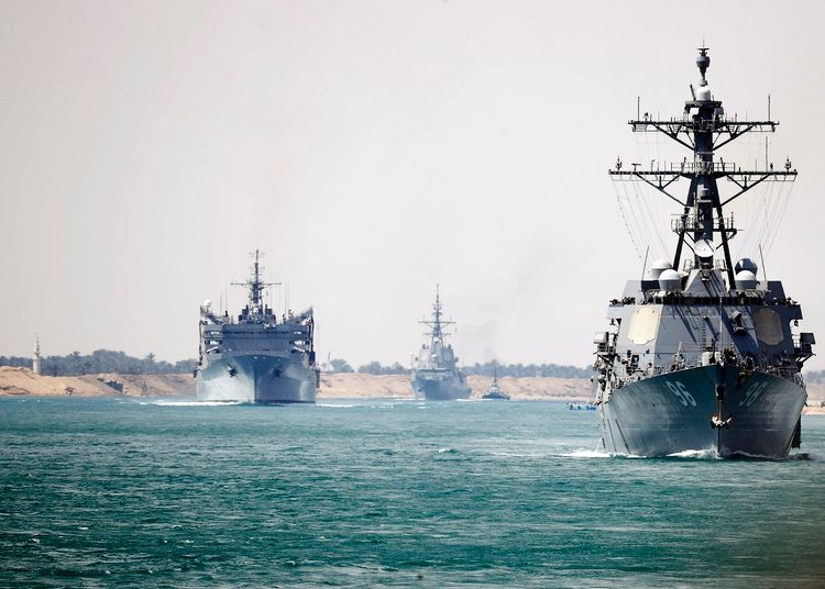 In this photo provided by the U.S. Navy, the Abraham Lincoln Carrier Strike Group transits the Suez Canal, Thursday, May 9, 2019.