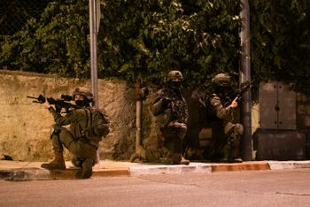 Israel Defense Forces (IDF) soldiers conduct an arrest in the West Bank.