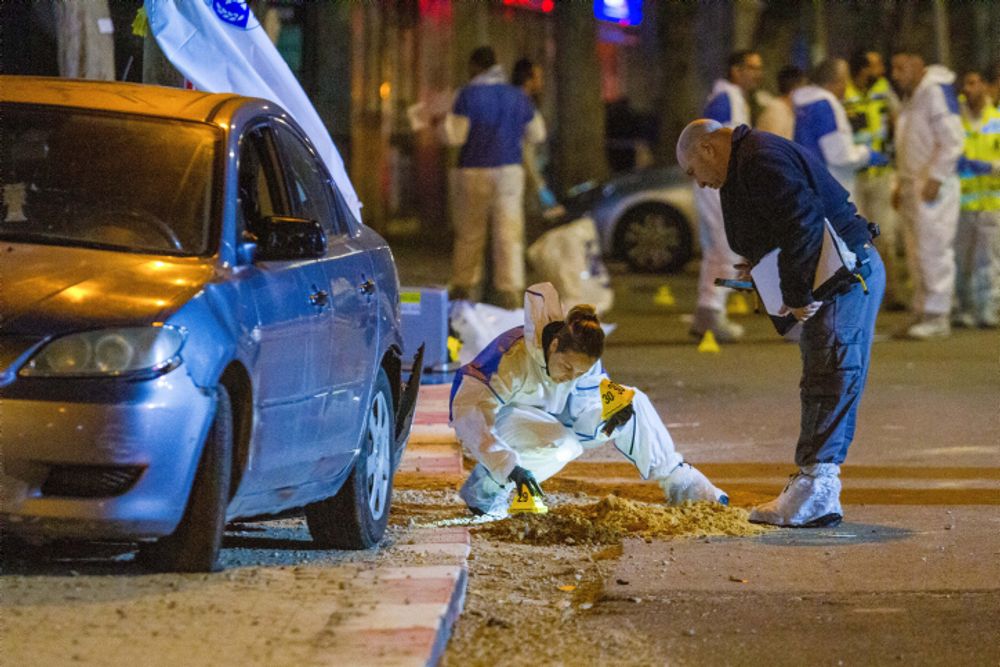 Israeli police officers at the scene of a shooting attack in Hadera, Israel, on March 27, 2022.