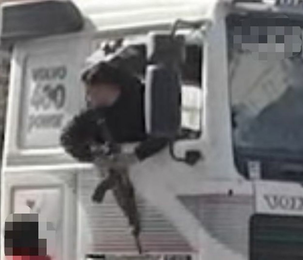 An alleged Hamas gunman seizes a truck carrying humanitarian aid in Gaza.