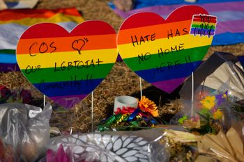 Heart-shaped signs bear messages of support in a makeshift memorial to the victims of a mass shooting at a gay nightclub in Colorado Springs, Colorado, the United States.