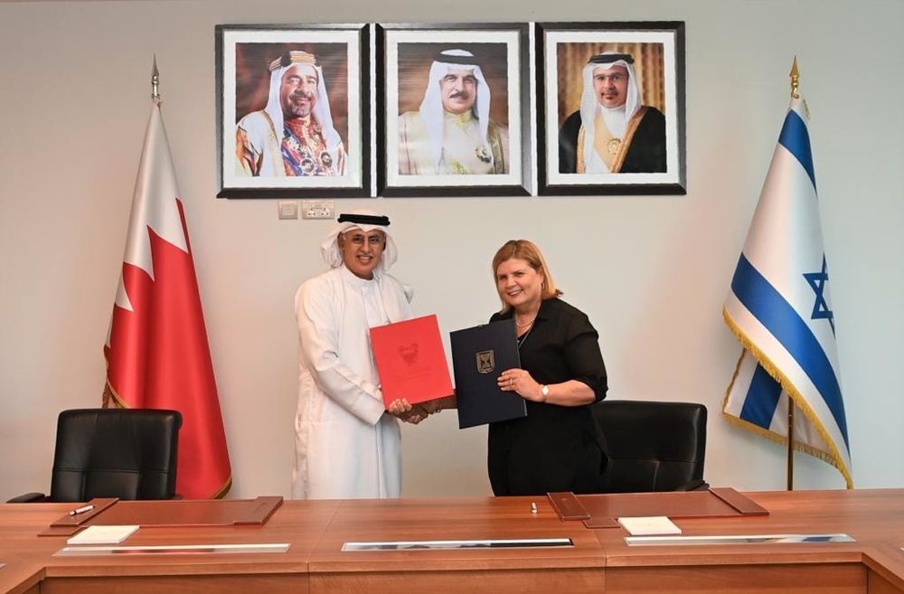 Israel's Economy Minister Orna Barbivai (R) and Bahraini Industry and Trade Minister Zayed bin Rashid Al Zayani in initial negotiations of a free trade agreement, in Manama, Bahrain, on September 19, 2022.