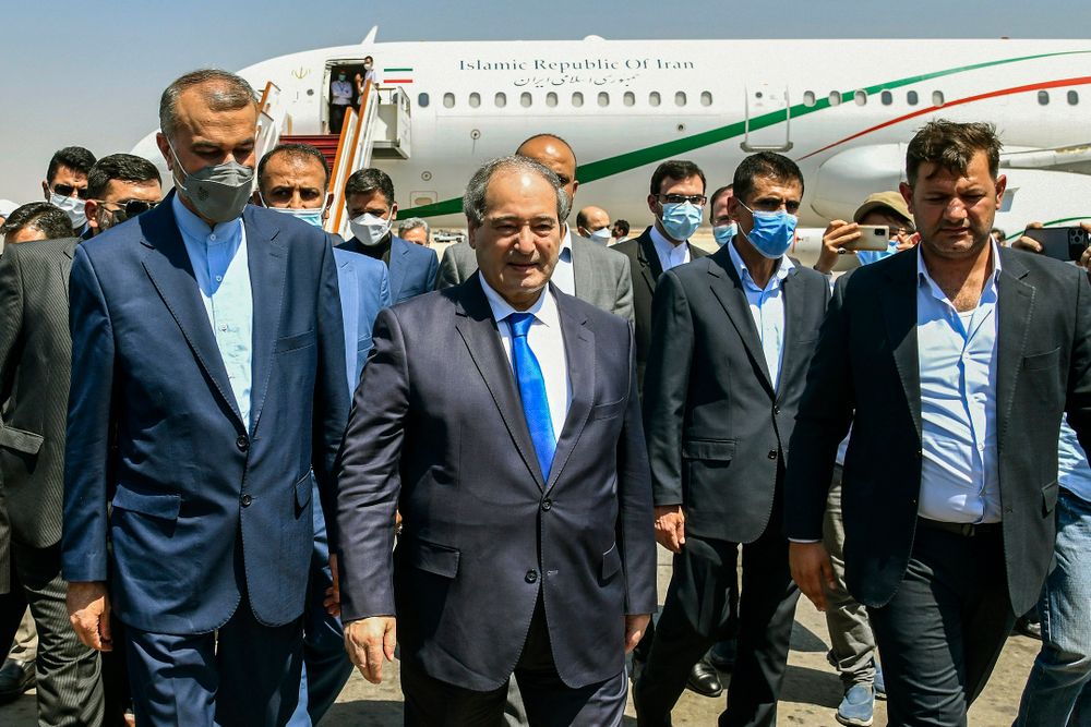 Syrian Foreign Minister Faisal Mekdad (center) welcomes his Iranian counterpart Hossein Amir-Abdollahian in Damascus, Syria on August 29, 2021