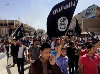 Demonstrators chant pro-Islamic State group slogans in Mosul, Iraq, during the group's control of the city