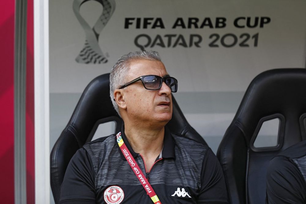 Tunisia's coach Mondher Kebaier watches the FIFA Arab Cup 2021 group B football match between Tunisia and Mauritania in the city of al-Rayyan, Qatar, on November 30, 2021.