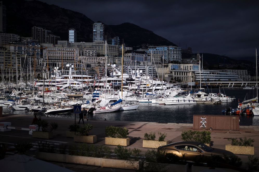 FILE - A luxury car drives along Monaco Harbor, Nov. 19, 2020. 

