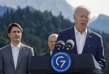 US President Joe Biden (R) speaks next to Canadian Prime Minister Justin Trudeau and German Chancellor Olaf Scholz during the G7 leaders' summit in Elmau Castle, Germany, on June 26, 2022.