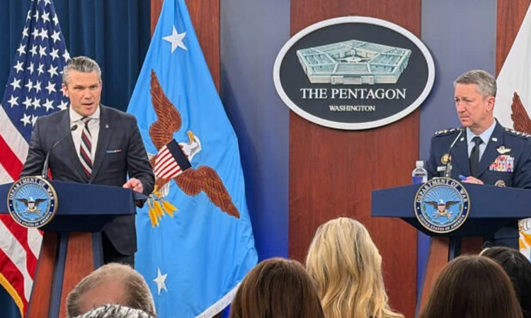 U.S. Secretary of Defense Pete Hegseth and Chairman of the Joint Chiefs of Staff General Dan Caine speak at a press briefing at the Pentagon on March 4, 2026, in Washington.