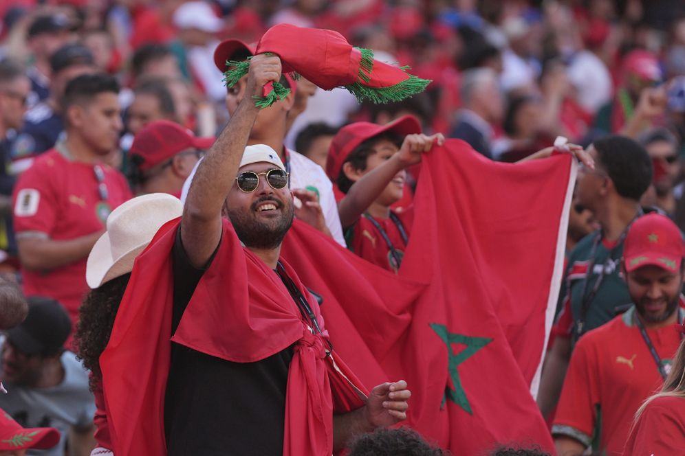 AP Photo/Charles Krupa Moroccan fans hold up flags as they wait for the start of the World Cup Group C soccer match between Scotland and Morocco in Foxborough, Mass., near Boston, Friday, June 19, 2026.