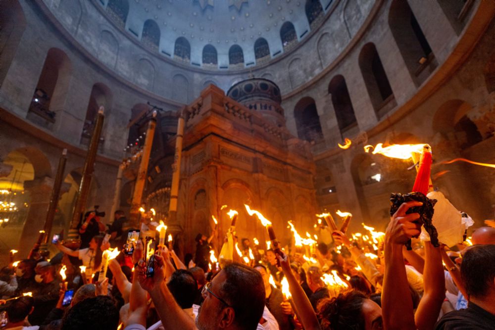 Orthodox Christian worshipers take part in the Holy Fire ceremony at the Church of the Holy Sepulchre, in Jerusalem's Old City.