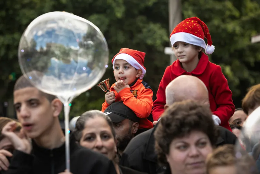 Arab Christians take part in the Christmas Parade in the Northern Israeli city of Nazareth, on Christmas Eve, on December 24, 2018