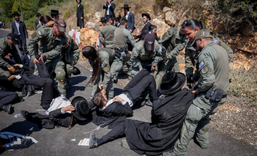 Ultra-Orthodox protesters clash with law enforcement after a demonstration in northern Israel was declared illegal