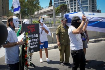 Israeli soldiers who suffer from PTSD protest against the state's treatment outside the Defence Ministry offices in Tel Aviv, Israel, on July 14, 2019.